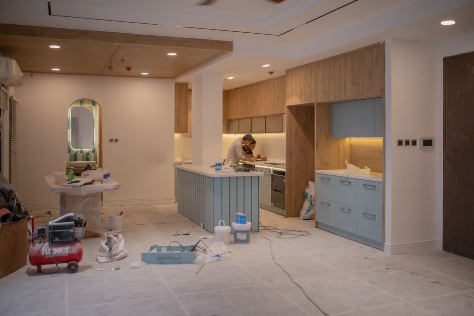 Professional installing kitchen cabinets